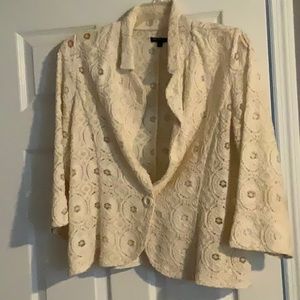 Beige jacket. Lace detail with one chunky button.